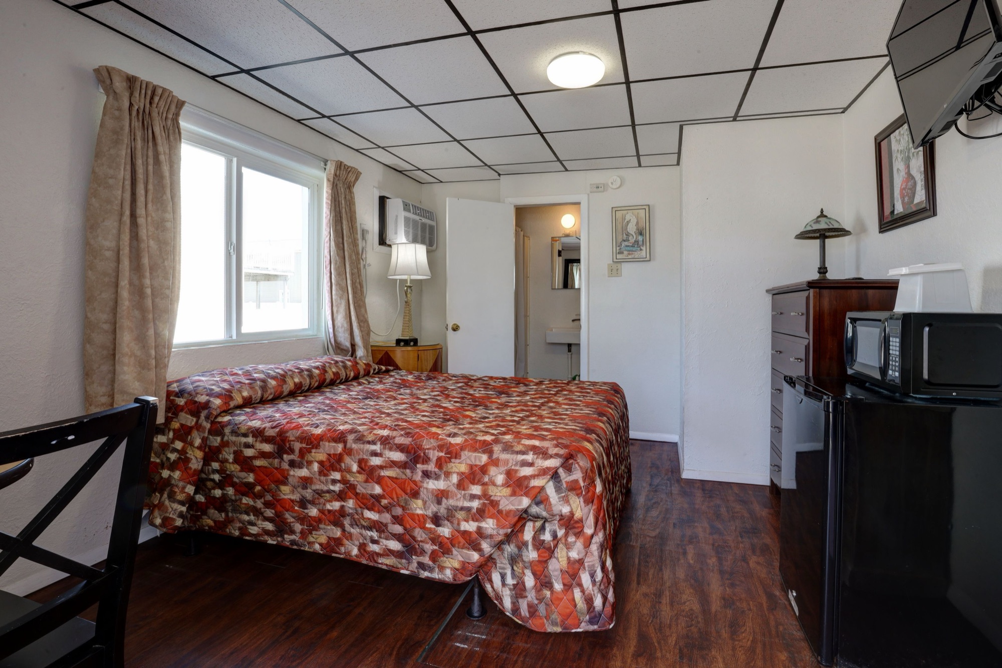 Type A motel room with one double bed
