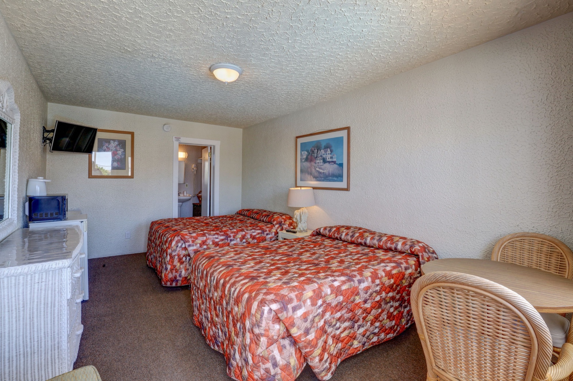 Type C poolside motel room with two double beds